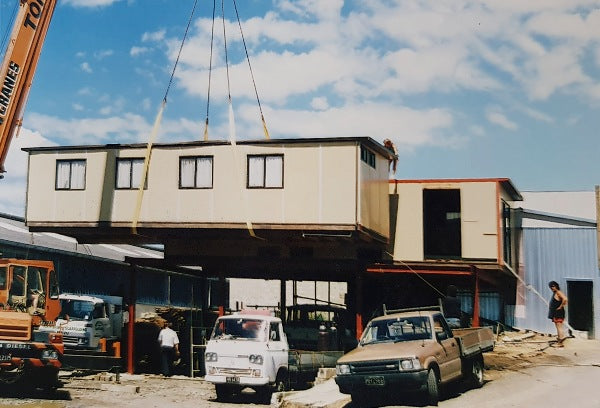 The portacom offices being lifted into place