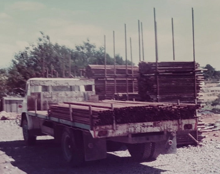 A truck loaded with black steel scaffolding
